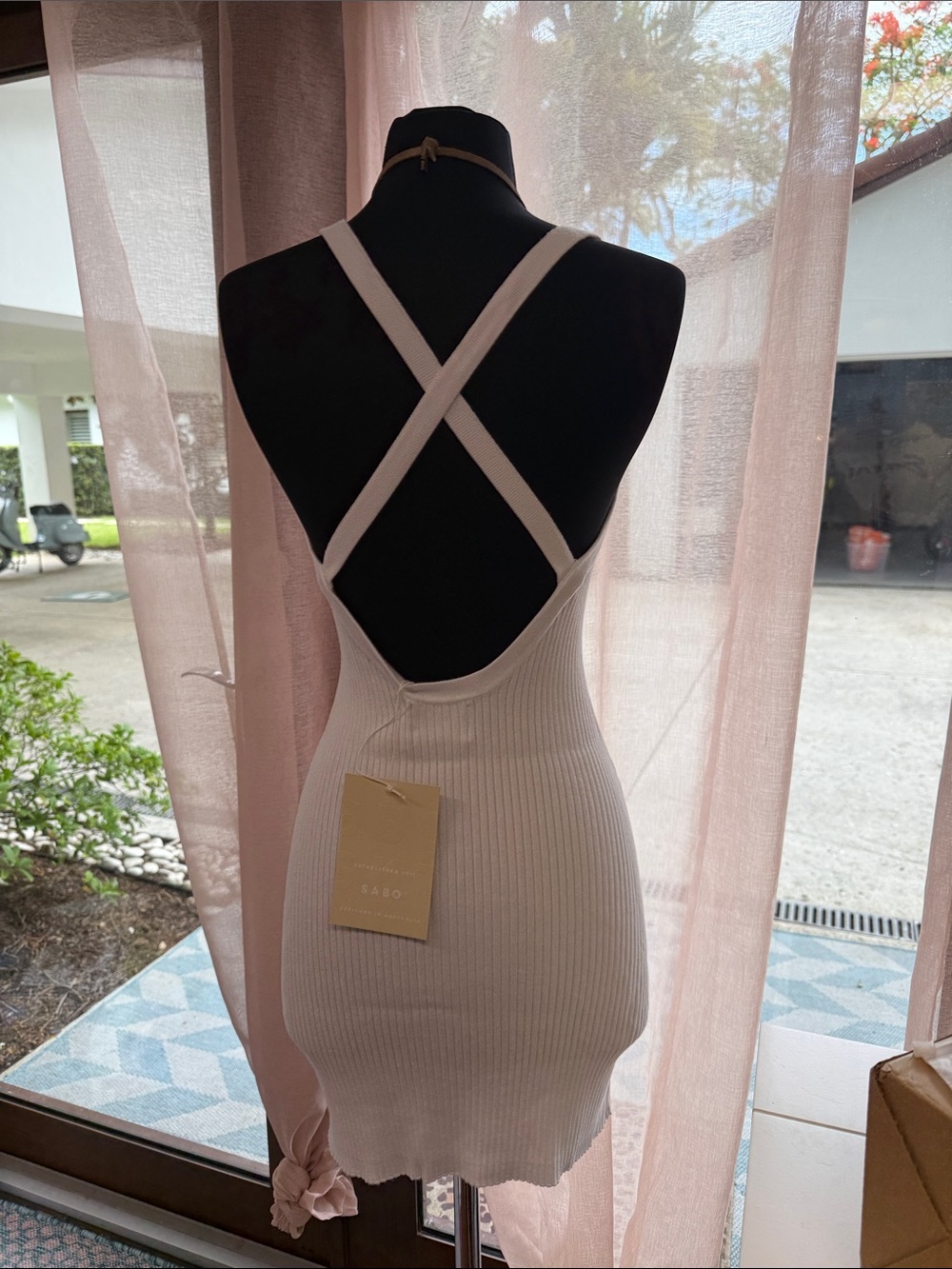 Sabo Skirt "Emine Dress" is a white ribbed knit garment designed in Australia